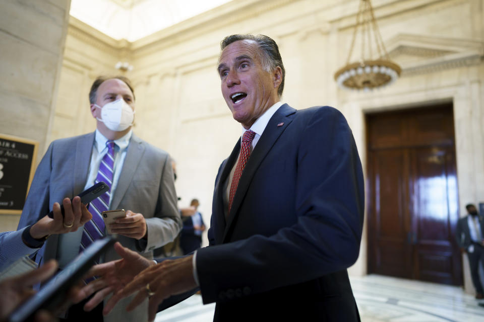 Sen. Mitt Romney, R-Utah, talks briefly to reporters after attending a bipartisan barbecue luncheon, at the Capitol in Washington, Thursday, Sept. 23, 2021. Senate Majority Leader Chuck Schumer and House Speaker Nancy Pelosi say they and the White House have agreed to a "framework" to pay for their emerging $3.5 trillion social and environment bill. (AP Photo/J. Scott Applewhite)