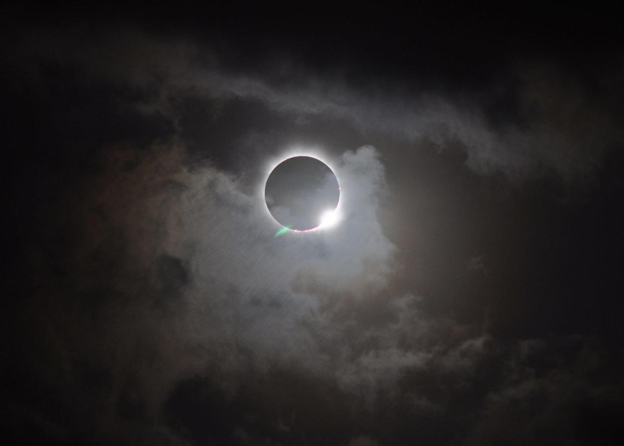 A total solar eclipse was visible from the Northern tip of Australia on Nov. 13, 2012, at 3:35 EST. The light halo visible around the edges of the moon is the sun’s atmosphere, the corona.