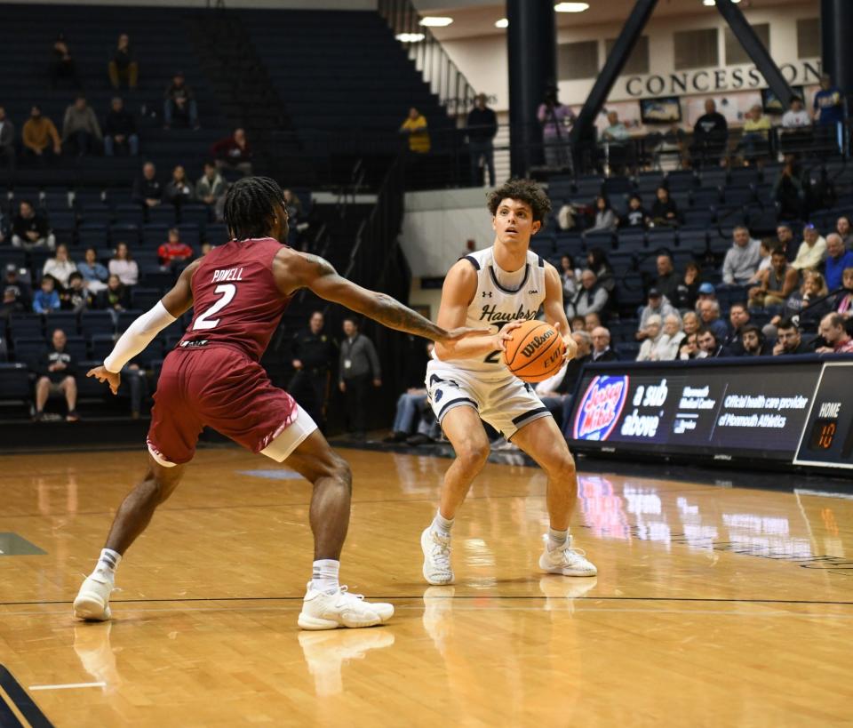 Monmouth's Xander Rice lines up a shot in a win over Rider at OceanFirst Bank Center in West Long Branch on Dec. 16, 2023.
(Credit: Emily Webb)