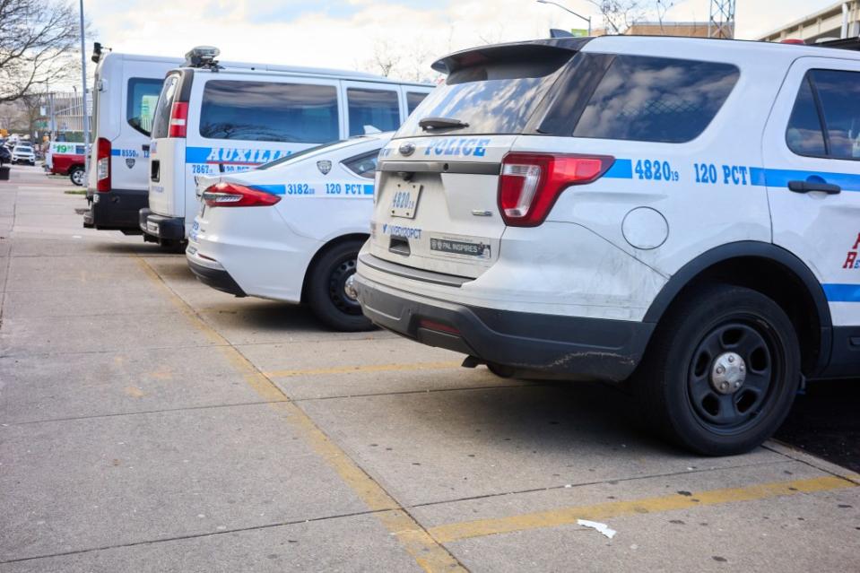NYPD vehicles parked on a sidewalk outside of the 120th Precinct on State Island on April 12, 2024. Michael McWeeney