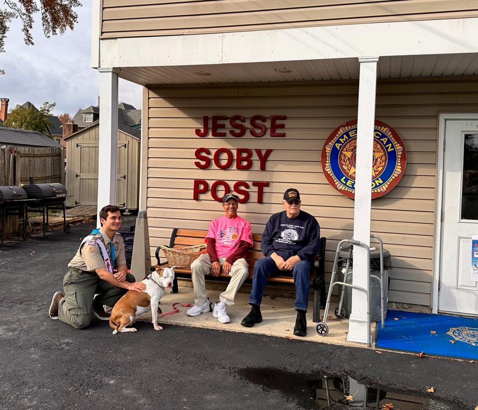 Boy Scout Tim Bess joins American Legion Post Commander Walt Davidson (right) and post Scout liaison Don Minnick as well as Minnick's dog, Daisy Mae, outside the Jesse W. Soby Post 148 in Langhorne where Tim raised funds for the installation of a new flagpole.