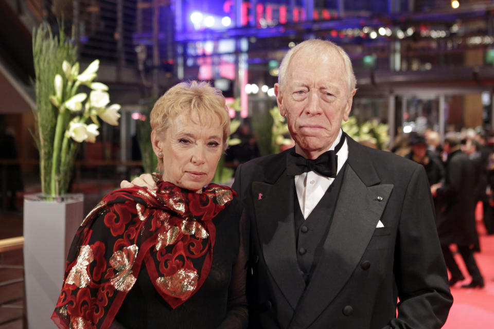 Actor Max von Sydow, right, and Catherine Brelet arrive on the red carpet for the film Extremely Loud and Incredibly Close during the 62nd  edition of International Film Festival Berlinale, in Berlin Friday, Feb. 10, 2012. (AP Photo/Markus Schreiber)