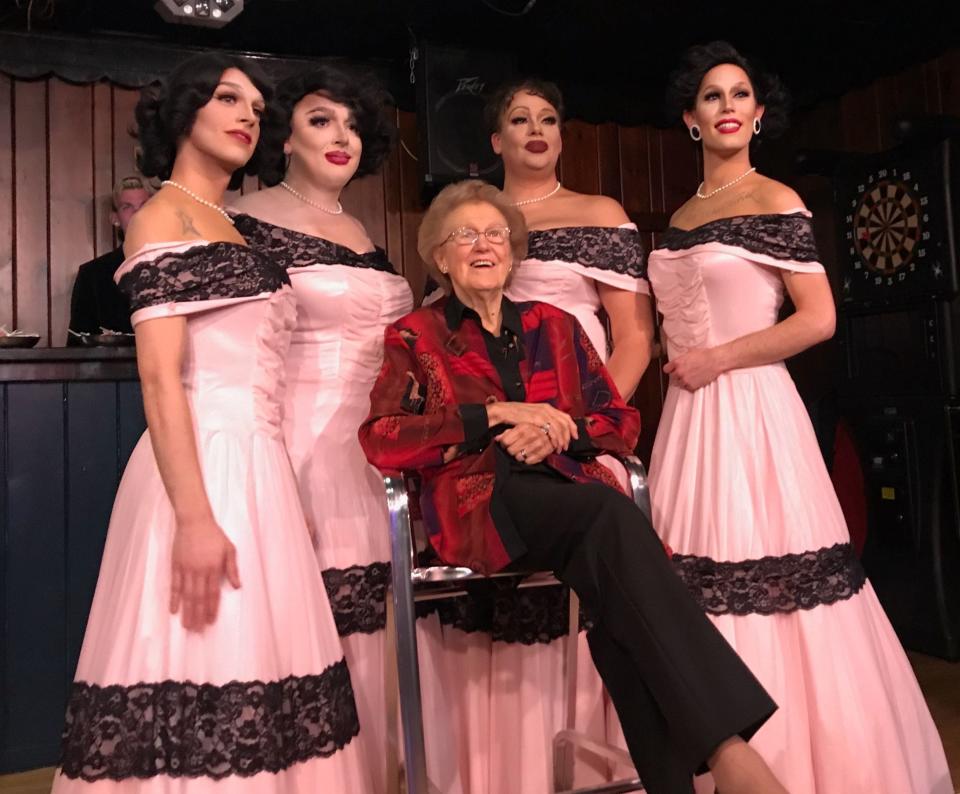 Carol Buschmann poses with Ivy Viola and three other drag queens in November 2018. The queens performed Chordettes songs while wearing Chordettes dresses recreated by a local designer.