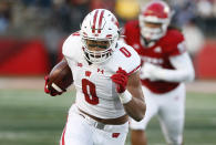 FILE - Wisconsin running back Braelon Allen (0) rushes against Rutgers during the second half of an NCAA college football game Saturday, Nov. 6, 2021, in Piscataway, N.J. Allen is a top contender for the 2022 Doak Walker Award. (AP Photo/Noah K. Murray, File)