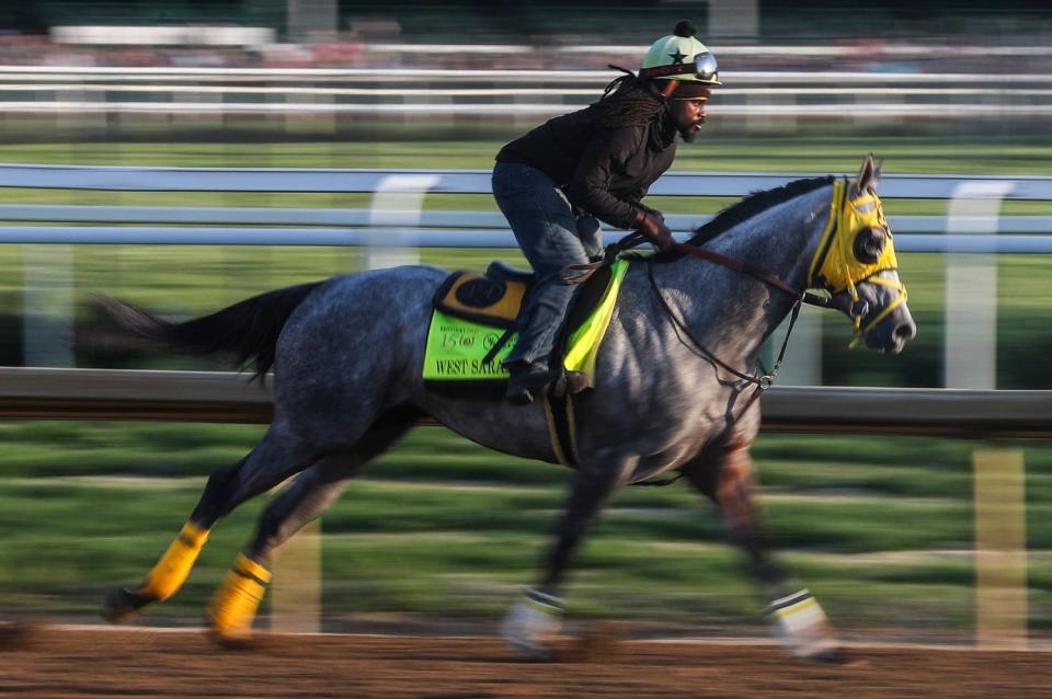 Kentucky Derby contender West Saratoga, currently at 30-1 odds, works the track with exercise rider Donte Lowery at Churchill Downs in Louisville, Ky. Monday morning April 29, 2024.