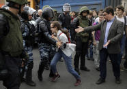 <p>A young girl reacts after her friend was detained by police during a demonstration in downtown Moscow, Russia, Monday, June 12, 2017. (Pavel Golovkin/AP) </p>