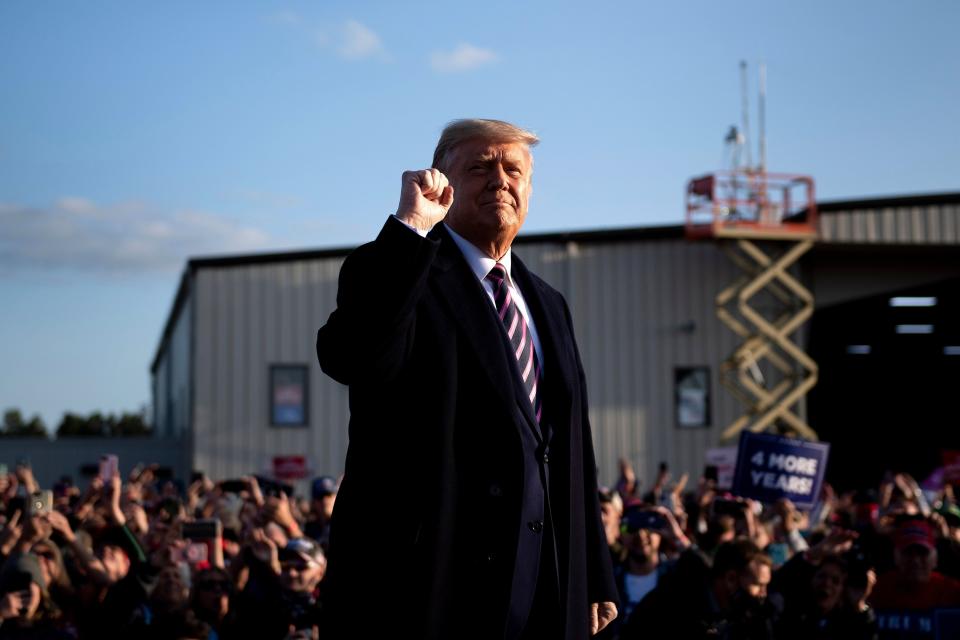 President Donald Trump pumps his fist as he arrives for a "Great American Comeback" rally Friday in Bemidji, Minnesota. Trump may try to get a third Supreme Court nominee confirmed before the November election. (BRENDAN SMIALOWSKI/AFP via Getty Images)