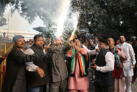 Supporters of Congress party celebrate after initial poll results at the party headquarters in New Delhi, December 11, 2018. REUTERS/Anushree Fadnavis