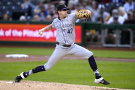 Colorado Rockies starting pitcher Cal Quantrill delivers during the second inning of a baseball game against the Pittsburgh Pirates in Pittsburgh, Friday, May 3, 2024. (AP Photo/Gene J. Puskar)