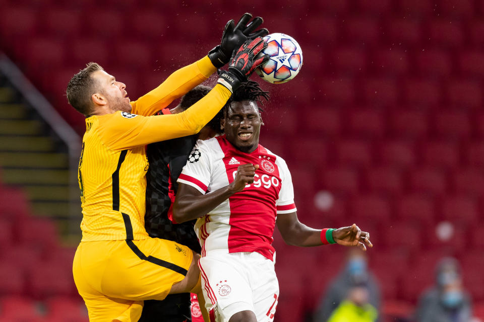 Goalkeeper Adrian (left) and Liverpool's defense had an uneasy time seeing out a win at Ajax to open the Champions League. (Photo by Alex Gottschalk/DeFodi Images via Getty Images)