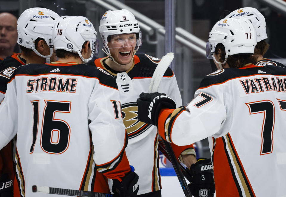 Anaheim Ducks defenseman John Klingberg, center, celebrates with teammates after his winning goal against the Edmonton Oilers during third-period NHL hockey game action in Edmonton, Alberta, Saturday, Dec. 17, 2022. (Jeff McIntosh/The Canadian Press via AP)