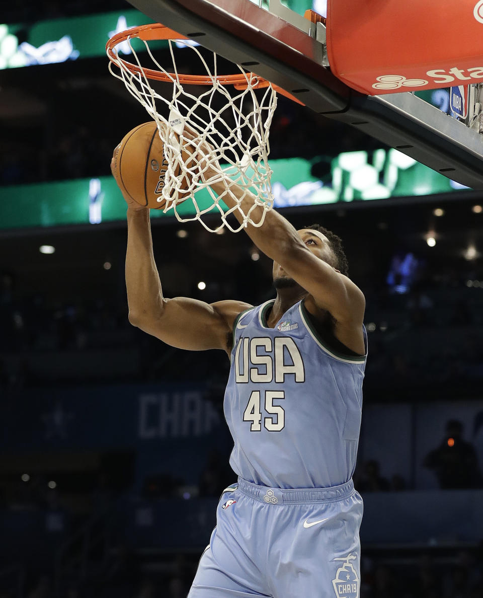 U.S. Team's Donovan Mitchell, of the Utah Jazz, heads to the basket against the World Team during the NBA All-Star Rising Stars basketball game, Friday, Feb. 15, 2019, in Charlotte, N.C. (AP Photo/Chuck Burton)
