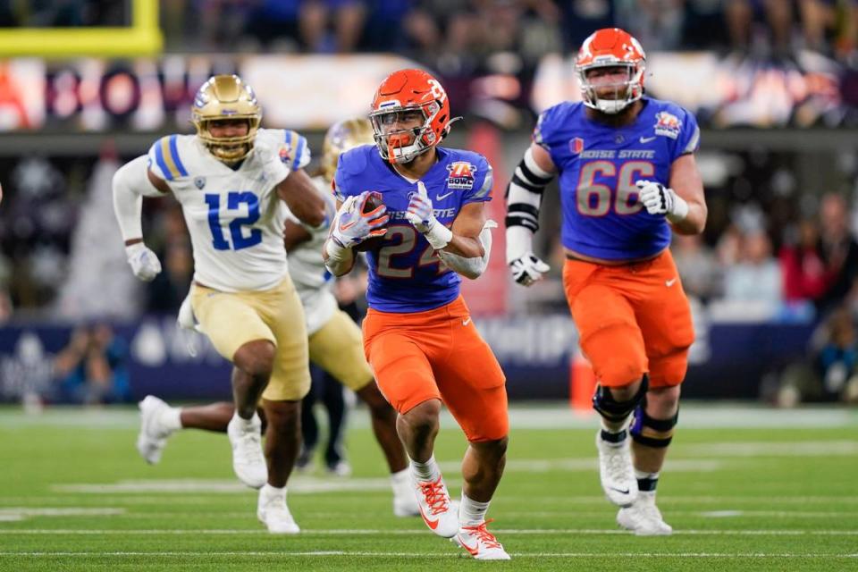 Boise State running back George Holani pulls away from the defense on a 66-yard touchdown run in the fourth quarter of the Broncos’ x-x loss to UCLA in the LA Bowl.