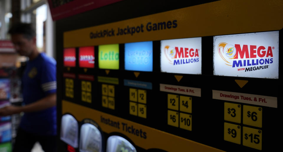 FILE - A lottery ticket vending machine in a convenience store, July 21, 2022, in Northbrook, Ill. The next Mega Millions drawing is Tuesday, July 25. (AP Photo/Nam Y. Huh, file)