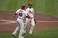 St. Louis Cardinals' Harrison Bader (48) congratulates teammate Edmundo Sosa (63) after Sosa scored during the second inning of a baseball game against the Pittsburgh Pirates Tuesday, May 18, 2021, in St. Louis. (AP Photo/Jeff Roberson)