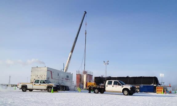 A new pump is installed to help manage wellhead pressure at a test of methane hydrate production technology in Alaska's North Slope.