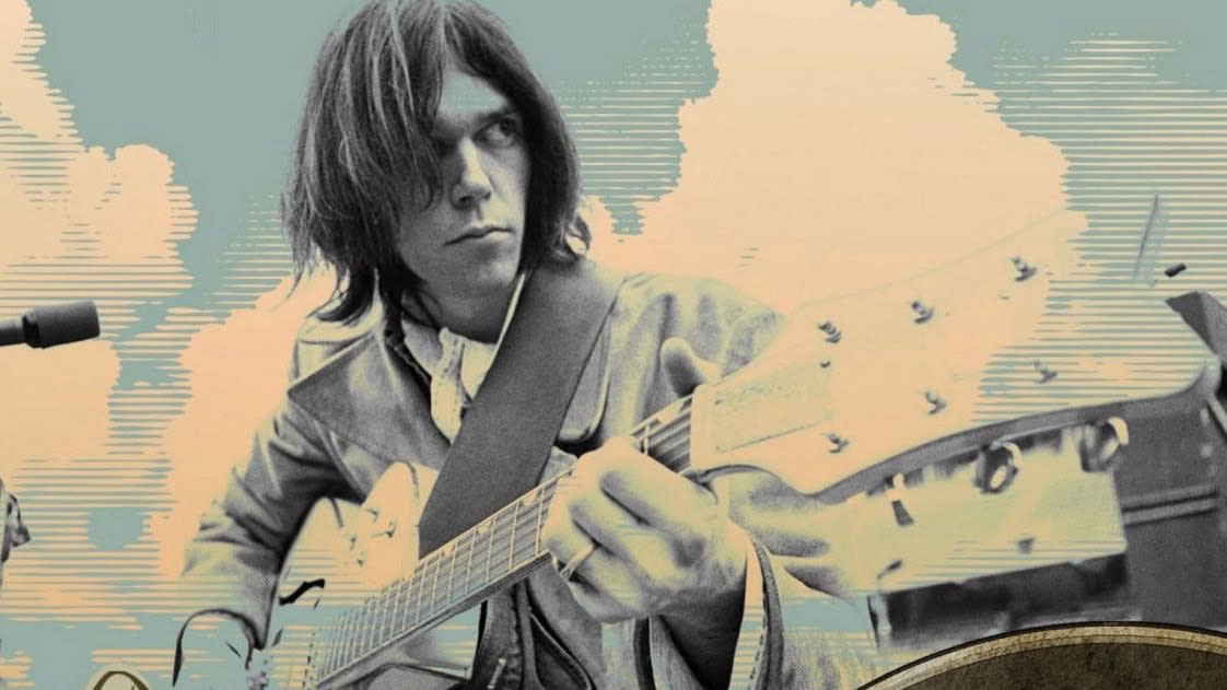  Neil Young playing guitar. 