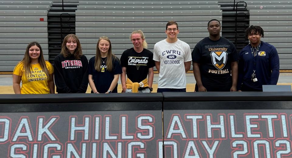 Oak Hills had a Signing Day ceremony May 11 where athletes signed to play college sports. They are, from left: Kennedy Gray, Northern Kentucky University cheerleading; Carly Shiplett, Wittenberg University soccer; Abby Cole, Mount St. Joseph University soccer and basketball; Cannon Kartye, University of Colorado Colorado Springs cross country and track & field; 
Mason Bencurik, Case Western Reserve University swimming; D.J. Armfield, Manchester University football; Micah Hicks, Mount St. Joseph University football.