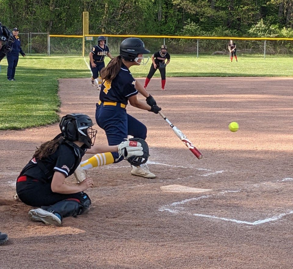 Abbi England hits for Erie Mason Monday against Toledo Cardinal Stritch. Mason earned its first win of the season.