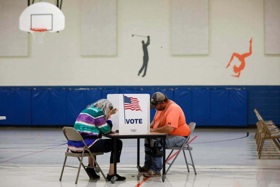 Voters cast their ballots at Truman Elementary School on Tuesday, Nov. 8, 2022.