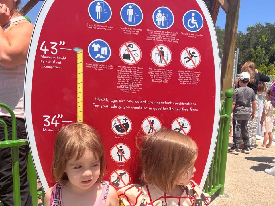 Twins standing at Peppa Pig theme park