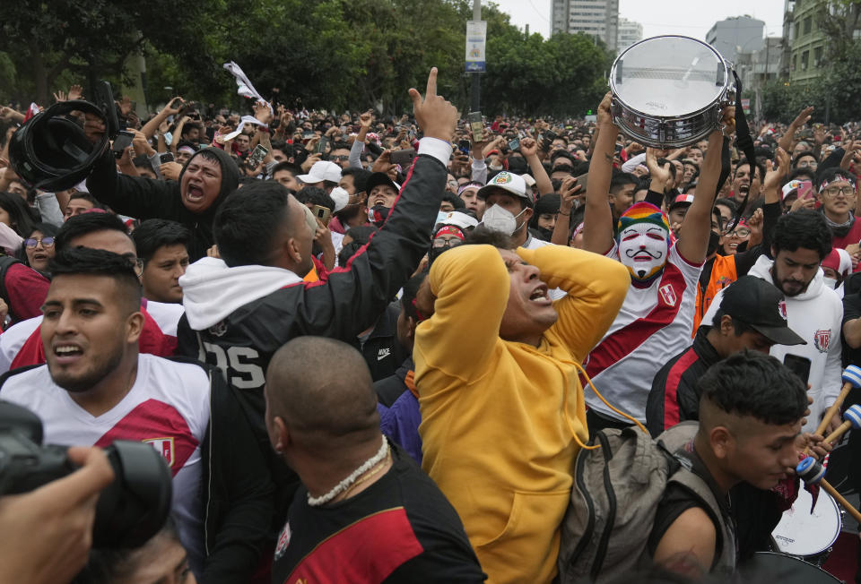 Peruvian fans react at the end of the World Cup 2022 qualifying play-off soccer match between Peru and Australia that was played in Qatar, in Lima, Peru, Monday, June 13, 2022. Australia won 5-4 in a penalty shootout and is now officially in the Qatar World Cup 2022. (AP Photo/Martin Mejia)