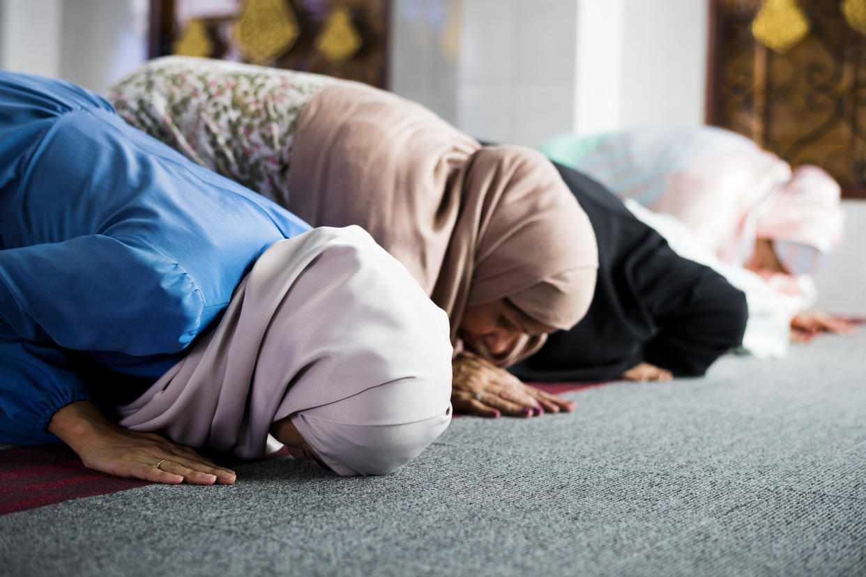 Muslim women praying in the mosque during Ramadan