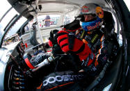 RICHMOND, VA - APRIL 27: Travis Pastrana, driver of the #99 Boost Mobile Toyota, sits in his car in the garage during practice for the NASCAR Nationwide Series Virginia 529 College Savings 250 at Richmond International Raceway on April 27, 2012 in Richmond, Virginia. (Photo by Tom Pennington/Getty Images for NASCAR)