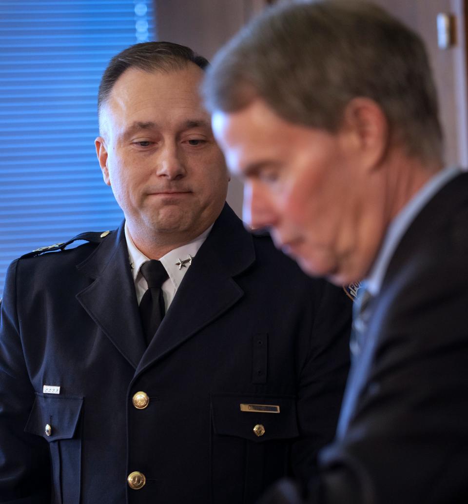 Mayor Joe Hogsett, right, gets ready to swear in the new Chief of the Indianapolis Metropolitan Police Department, Christopher Bailey, Monday, Feb. 12, 2024 during a press conference at the City/County Building.