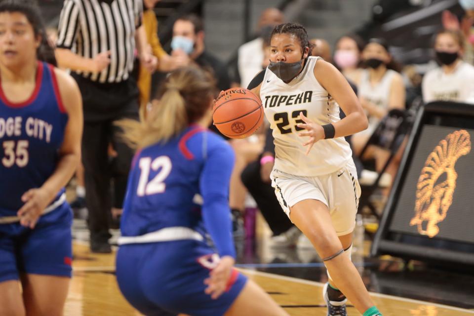 Topeka High's Kiki Smith dribbles down the court in last year's 6A semifinal game against Dodge City.