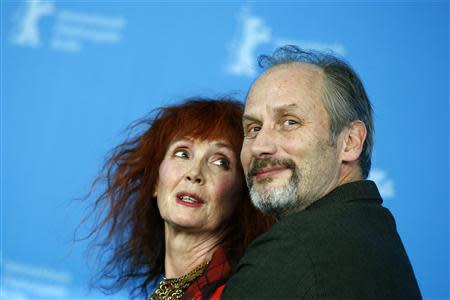 Cast members Sabine Azema (L) and Hippolyte Girardot pose during a photocall to promote the movie "Aimer, Boire Et Chanter" (Life of Riley) at the 64th Berlinale International Film Festival in Berlin February 10, 2014. REUTERS/Thomas Peter