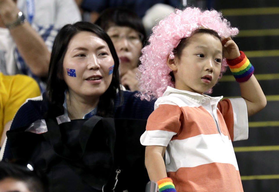 Fans wait for the start of the Rugby World Cup Pool D game at Sapporo Dome between Australia and Fiji in Sapporo, Japan, Saturday, Sept. 21, 2019. (AP Photo/Aaron Favila)