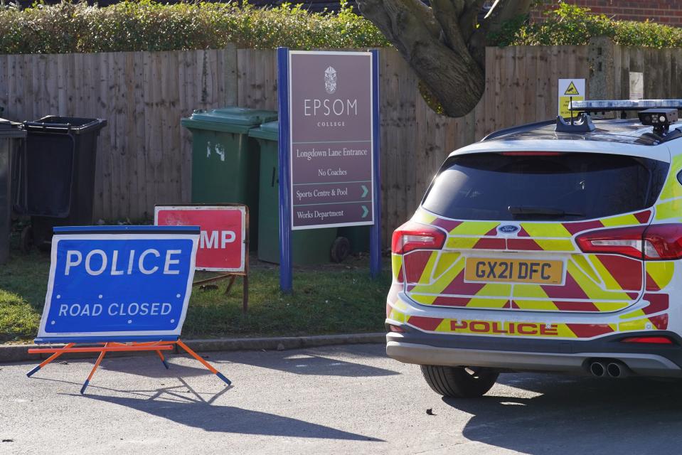 Police outside Epsom College, in Surrey (PA)