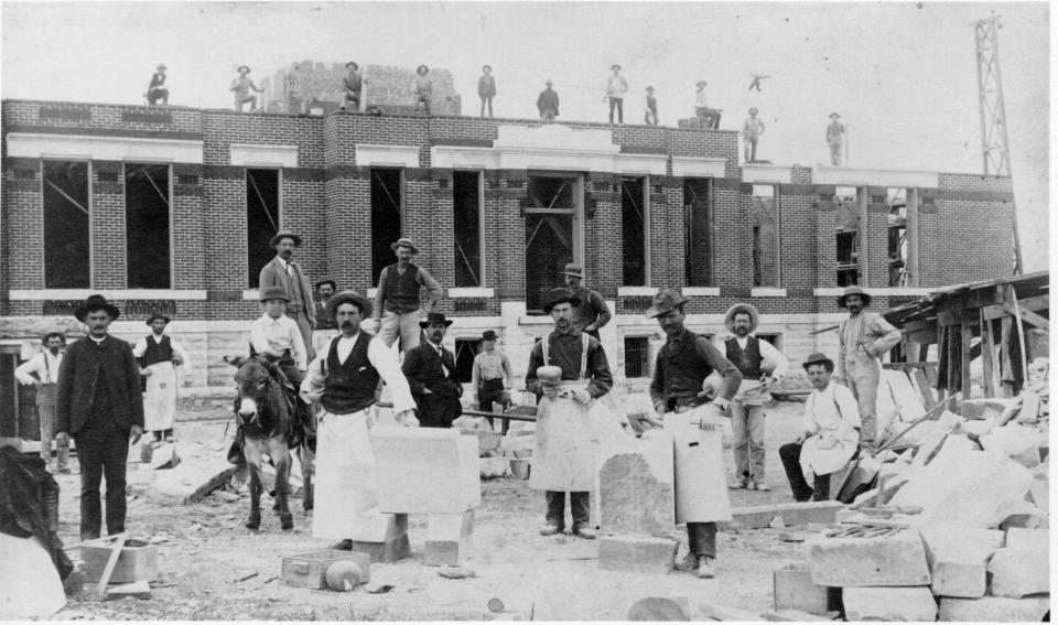 Larimer County's third courthouse was under construction at Mason and Oak Streets on the day Eva Howe was murdered by her husband, James. Later that night, a mob of townspeople broke James out of his jail cell and hanged him from the derrick pictured at right. It was the first and only known lynching in Fort Collins.