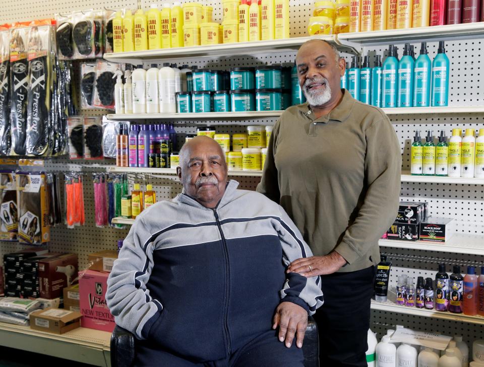 Owners and brothers James, 85, (left) and Sherman Willis, 76, pose inside Willis Beauty Supply on East Livingston Avenue in Driving Park. The store has been selling hair products since the late '60s.