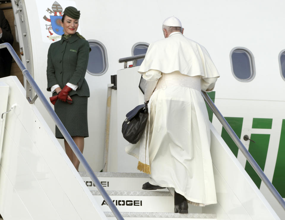 Pope Francis boards an airplane at Rome's Fiumicino international airport, Saturday, Aug. 25, 2018. The pontiff is traveling to Ireland for a two-day visit on the occasion of the 2018 World Meeting of Families. (AP Photo/Andrew Medichini)