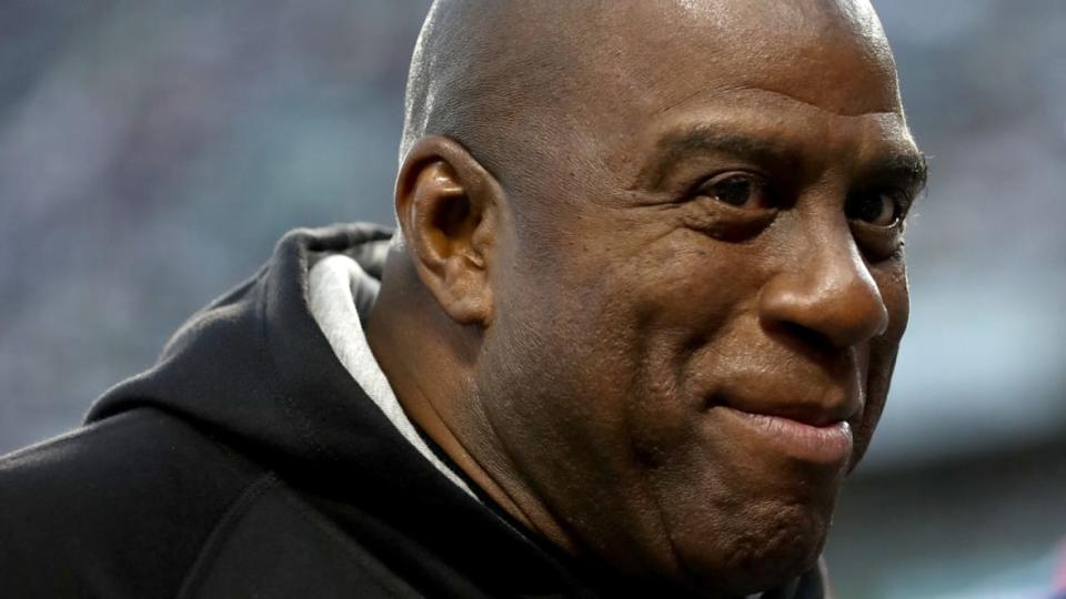 Earvin “Magic” Johnson (above), billionaire Mitchell Rales and other limited partners are part of Josh Harris’ latest professional sports endeavor: purchasing the Washington Commanders. (Photo: Ronald Martinez/Getty Images)