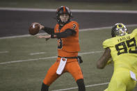 Oregon State quarterback Tristan Gebbia looks for a receiver during the first half of the team's NCAA college football game against Oregon in Corvallis, Ore., Friday, Nov. 27, 2020. (AP Photo/Amanda Loman)