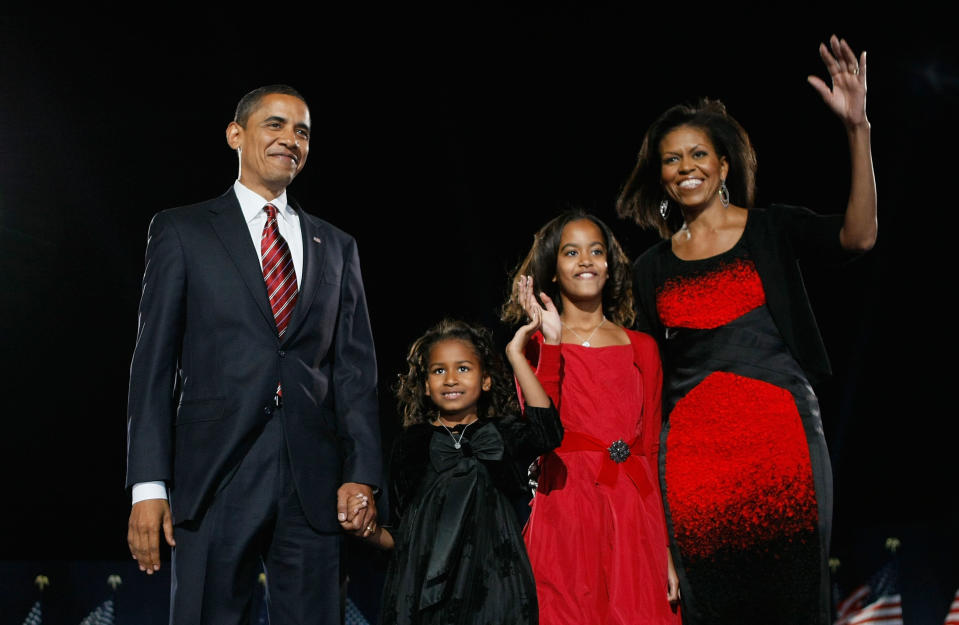 President elect Barack Obama (L) stands on stage along with his wife Michelle (R) and daughters Malia (2nd R) and Sasha during an election night gathering in Grant Park on November 4, 2008 in Chicago, Illinois. (Photo by Joe Raedle/Getty Images)