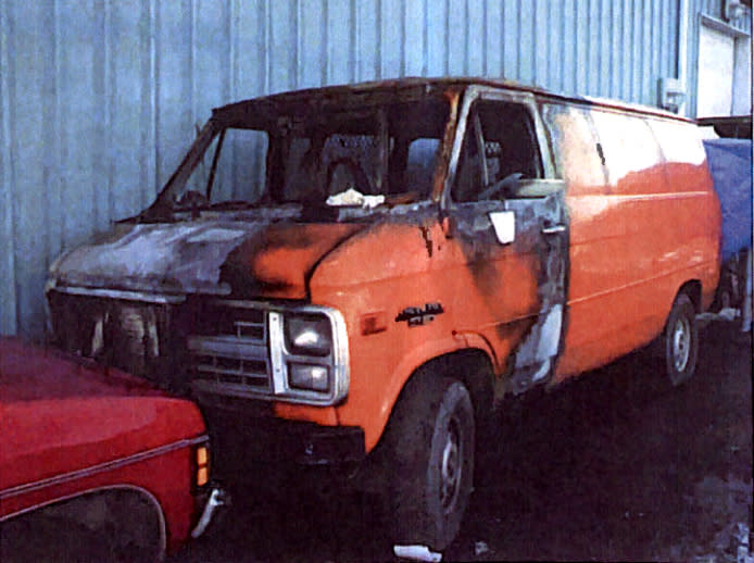 The van is seen in December 2002 hours after someone lit it on fire. (Image via San Mateo County Superior Court records)