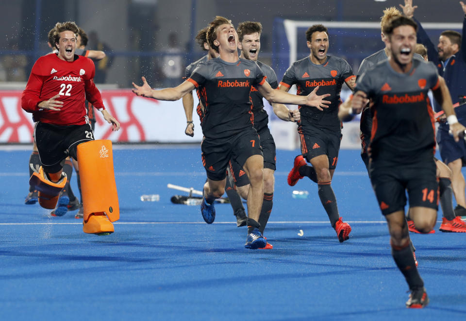 Netherlands players celebrate their win over Australia in the Men's Hockey World Cup semifinal match at Kalinga Stadium in Bhubaneswar, India, Saturday, Dec. 15, 2018. (AP Photo/Aijaz Rahi)