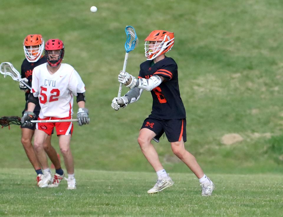 Middlebury's Logan McNulty sends a pass to a teammate during the Tigers' 9-5 win over CVU in the 2023 D1 semifinals.
