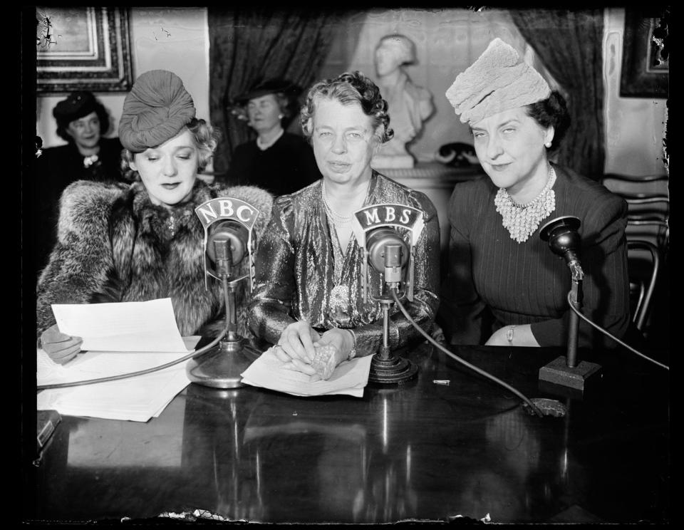 This black and white photograph is of First Lady Eleanor Roosevelt (middle) at a broadcast in the Diplomatic Reception Room to launch an initiative against infantile paralysis or polio.