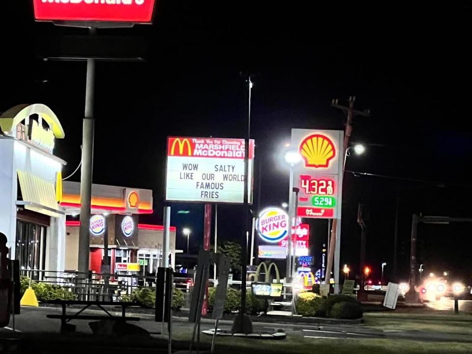 a McDonald's sign that says "wow, salty like our world famous fries"