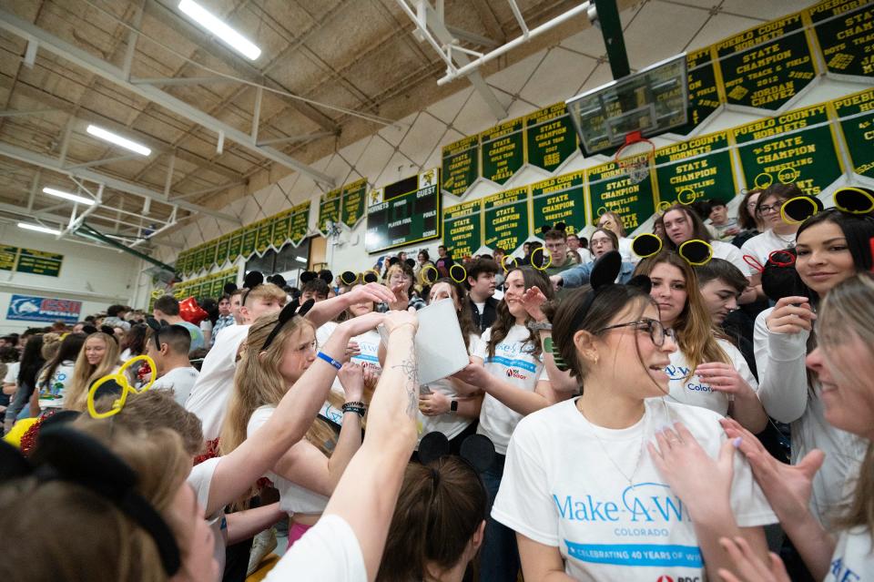 Pueblo County High School students raise money for the Make-a-Wish Foundation during the "Wish Week" assembly on Wednesday, March, 15, 2023.