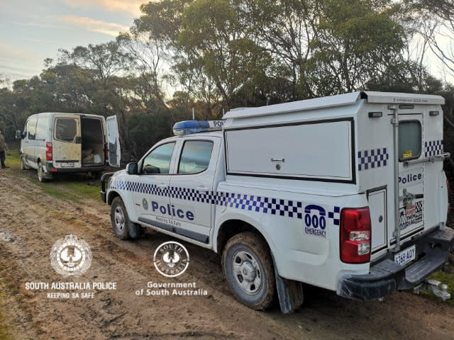 A police car parked behind a van that was used by two men to illegally cross into South Australia from Victoria. Source: South Australia Police