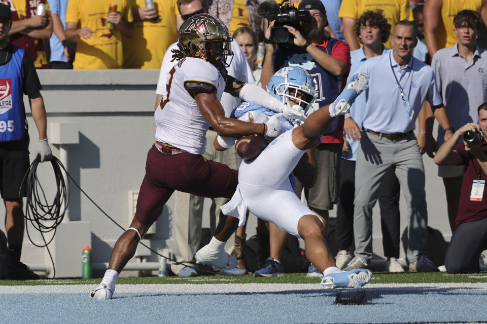 North Carolina defensive back Alijah Huzzie (28) breaks up a touchdown pass intended for Minnesota wide receiver Daniel Jackson (9) during the second quarter of an NCAA college football game, Saturday, Sept. 16, 2023, in Chapel Hill, N.C. (AP Photo/Reinhold Matay)