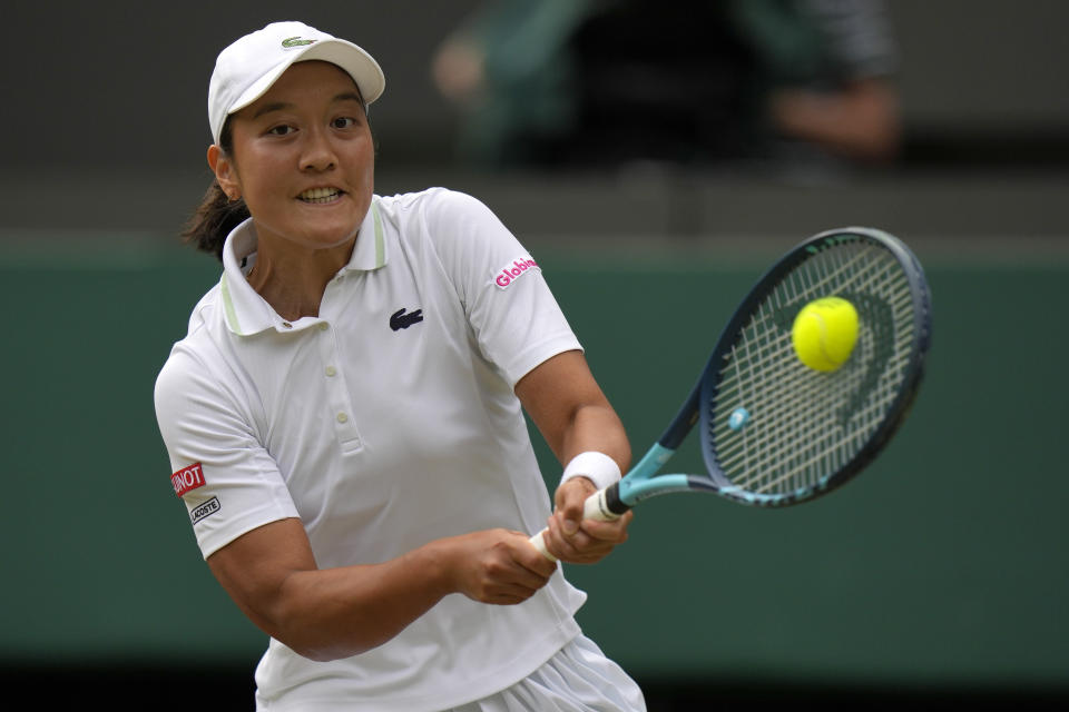 France's Harmony Tan returns to Amanda Anisimova of the US in a women's fourth round singles match on day eight of the Wimbledon tennis championships in London, Monday, July 4, 2022. (AP Photo/Alastair Grant)