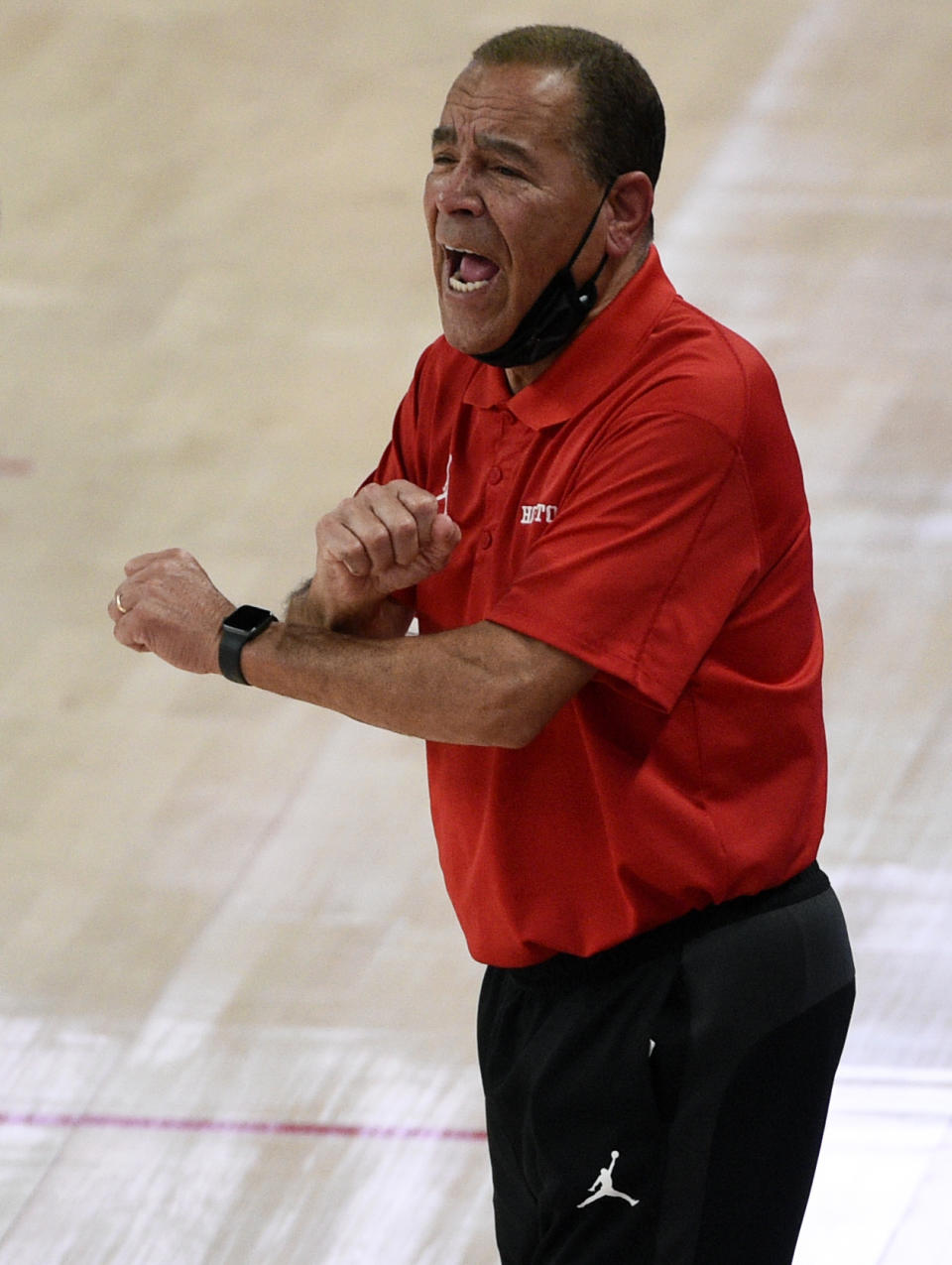 Houston head coach Kelvin Sampson yells instructions during the second half of an NCAA college basketball game against Cincinnati, Sunday, Feb. 21, 2021, in Houston. (AP Photo/Eric Christian Smith)