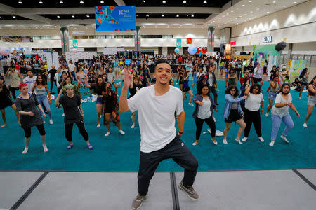 Attendees and K-pop fans learn dance moves at KCON USA, billed as the world's largest Korean culture convention and music festival, in Los Angeles, California, U.S. August 10, 2018. Picture taken on August 10, 2018. REUTERS/Mike Blake